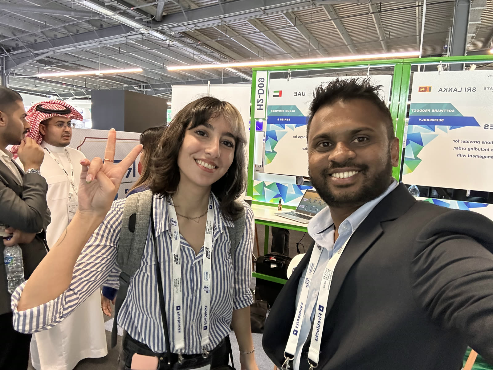 Namal Attanayake taking a photo with a visitor at the Parallax stand in Dubai