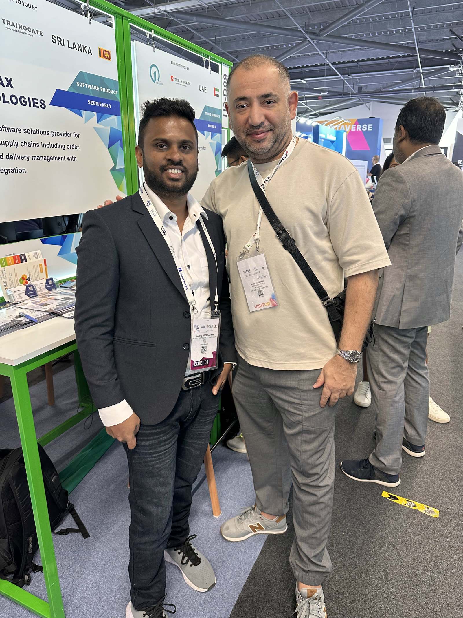 Namal Attanayake with a visitor in front of the Parallax stand in Dubai