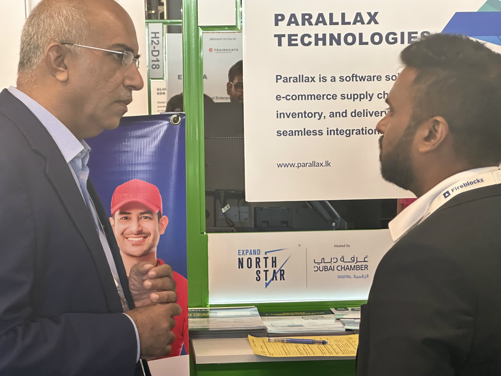 Namal Attanayake explaining Parallax software to a visitor at the stand