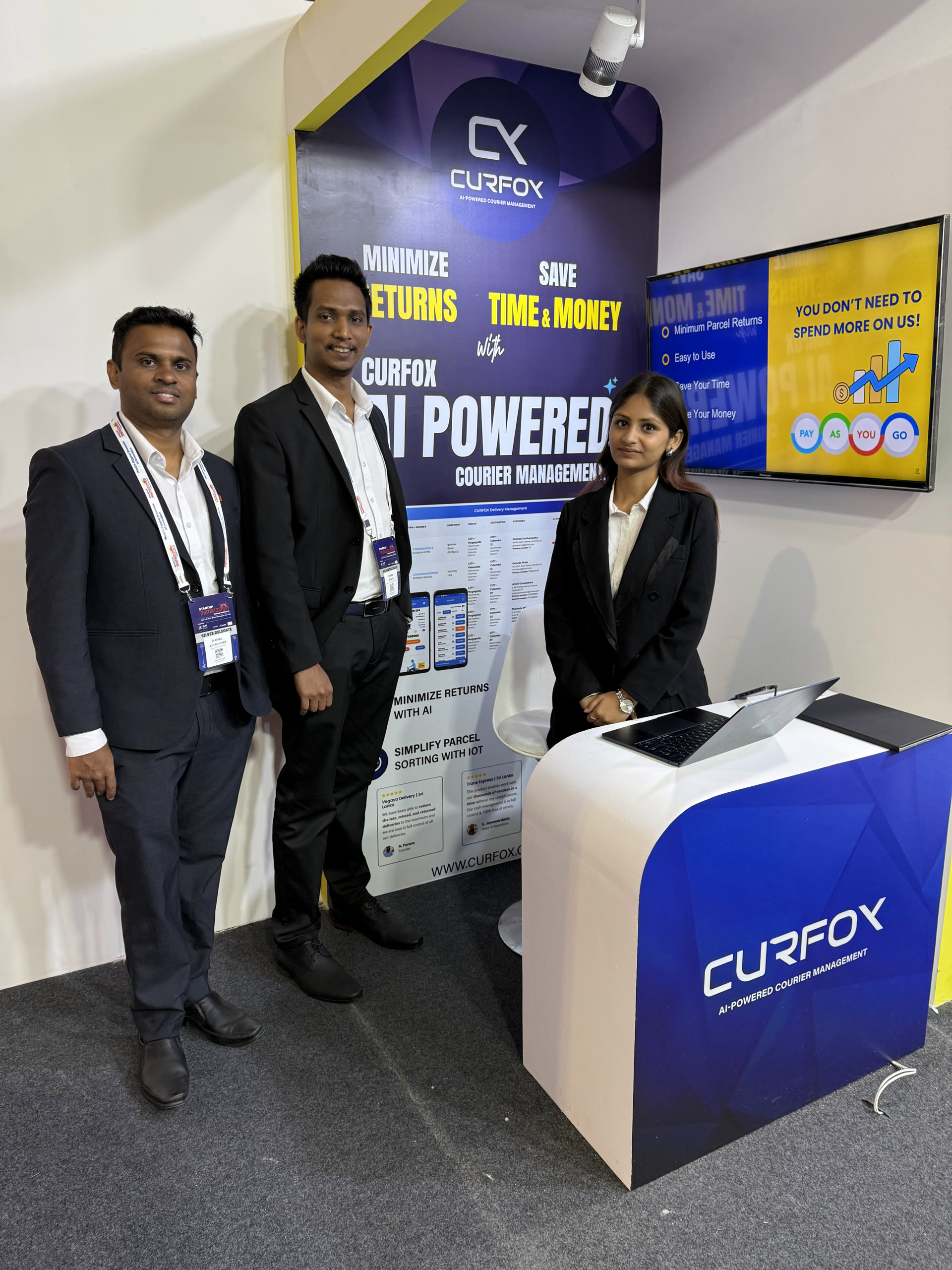 Namal Attanayake with two colleagues at the Curfox exhibition stand