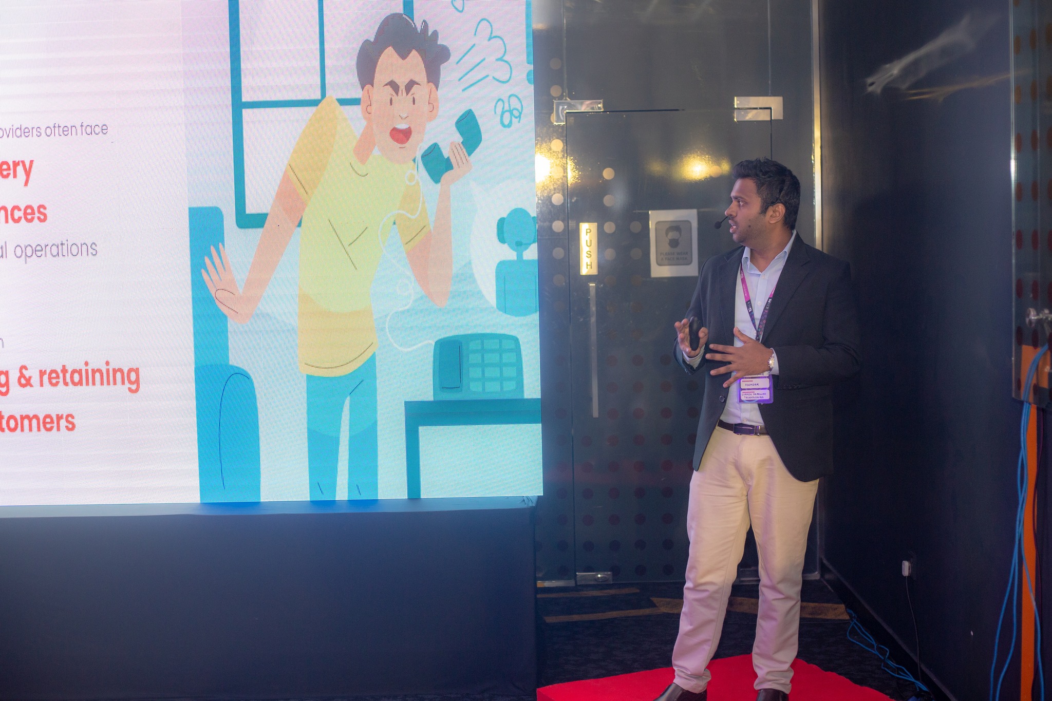 Namal Attanayake presenting on stage at ICTA Demo Day