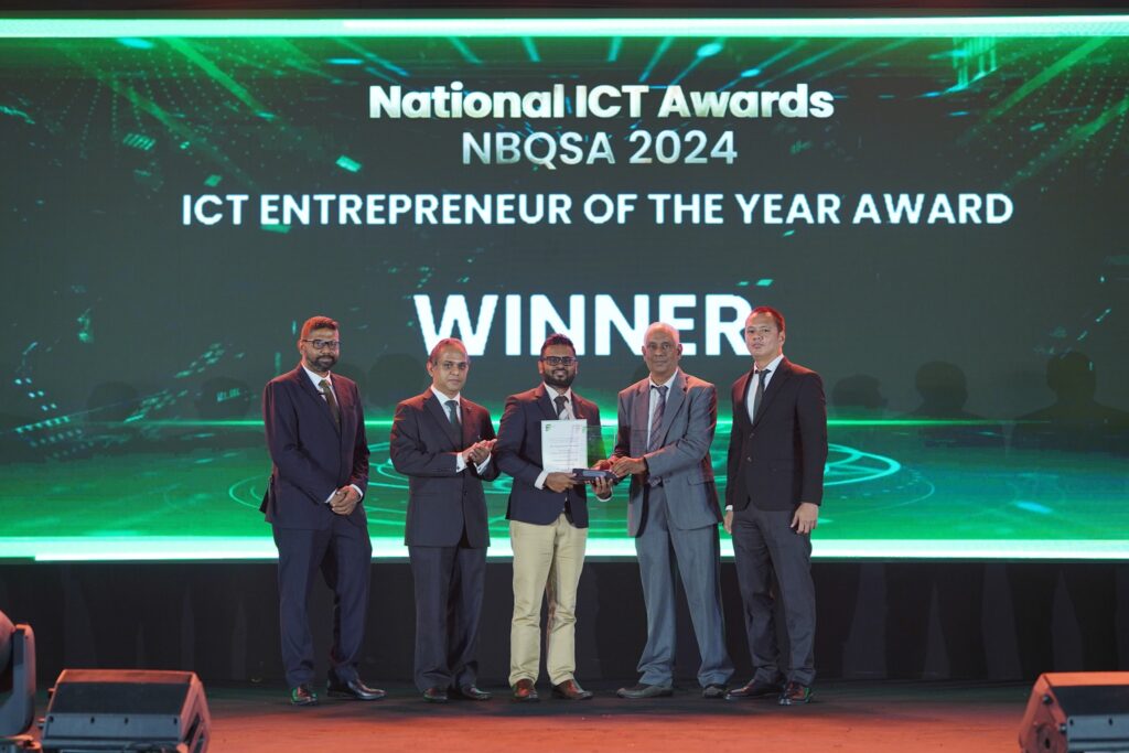 Namal Attanayake receiving the ICT Entrepreneur of the Year award on stage at the National ICT Awards NBQSA 2024