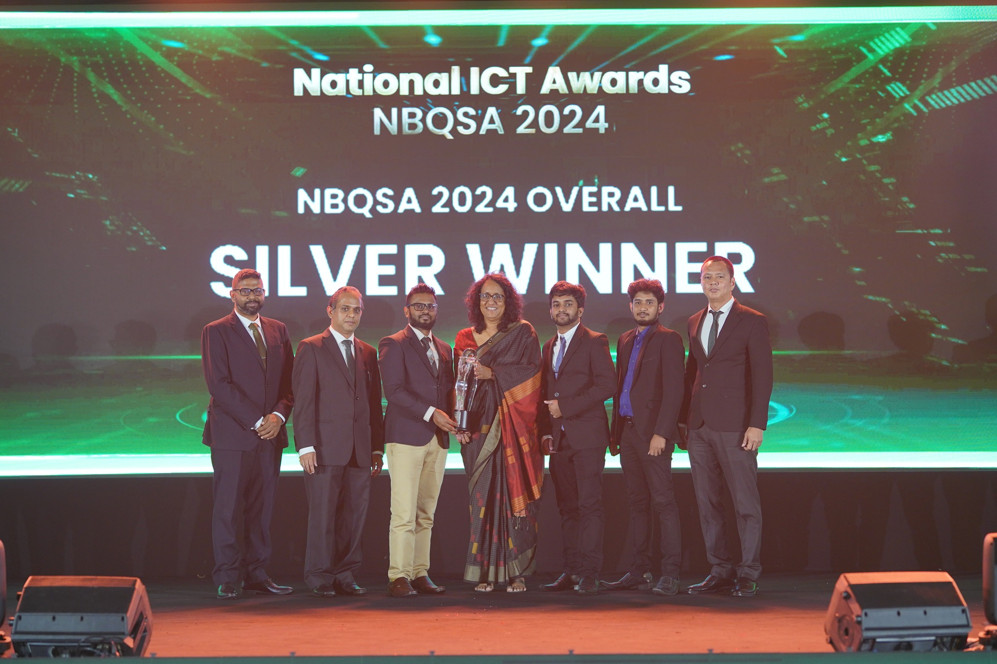 Namal Attanayake accepting the NBQSA 2024 Overall Silver award with the Parallax team